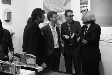 U.S. Secretary of Housing and Urban Development Shaun Donovan discussing Zago Architecture's proposal with Andrew Zago and Mohsen Mostafavi, Dean of the Harvard Graduate School of Design, at the September 17 Foreclosed Open Studios at MoMA PS1. 