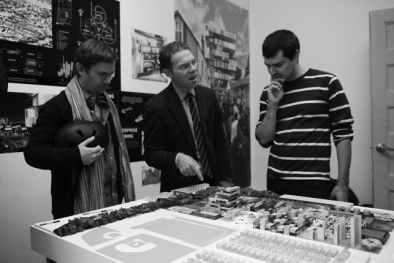 Studio Gang team member Greg Lindsay (center) discussing Studio Gang's site plan model with visitors at the September 17 Open Studios at MoMA PS1.