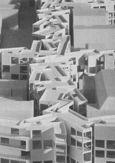 Architectural model of MOS's Thoughts on a Walking City project for Orange, New Jersey, showing the proposed mixed-use development in white filling the street spaces between the existing buildings in blue