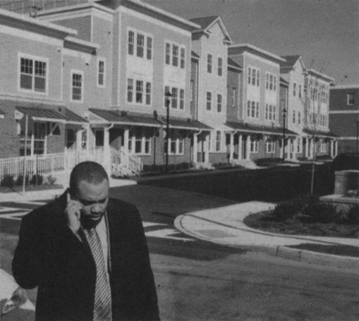 Heart of Orange. Mayor Elridge Hawkins Jr., left, at the new Walter G. Alexander housing project